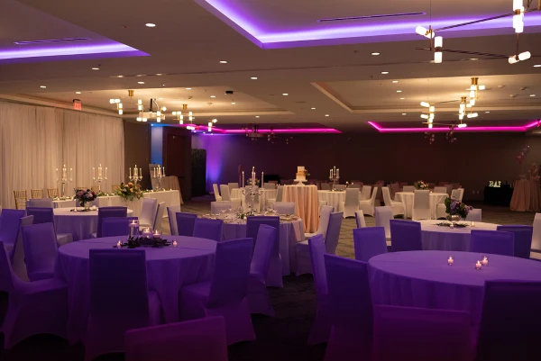 a room filled with lots of tables and chairs